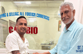 Businessman Lookeshwar ‘Vick’ Mahabeer (left) presents the sponsorship to Secretary of the DCB Davteerth Anandjit